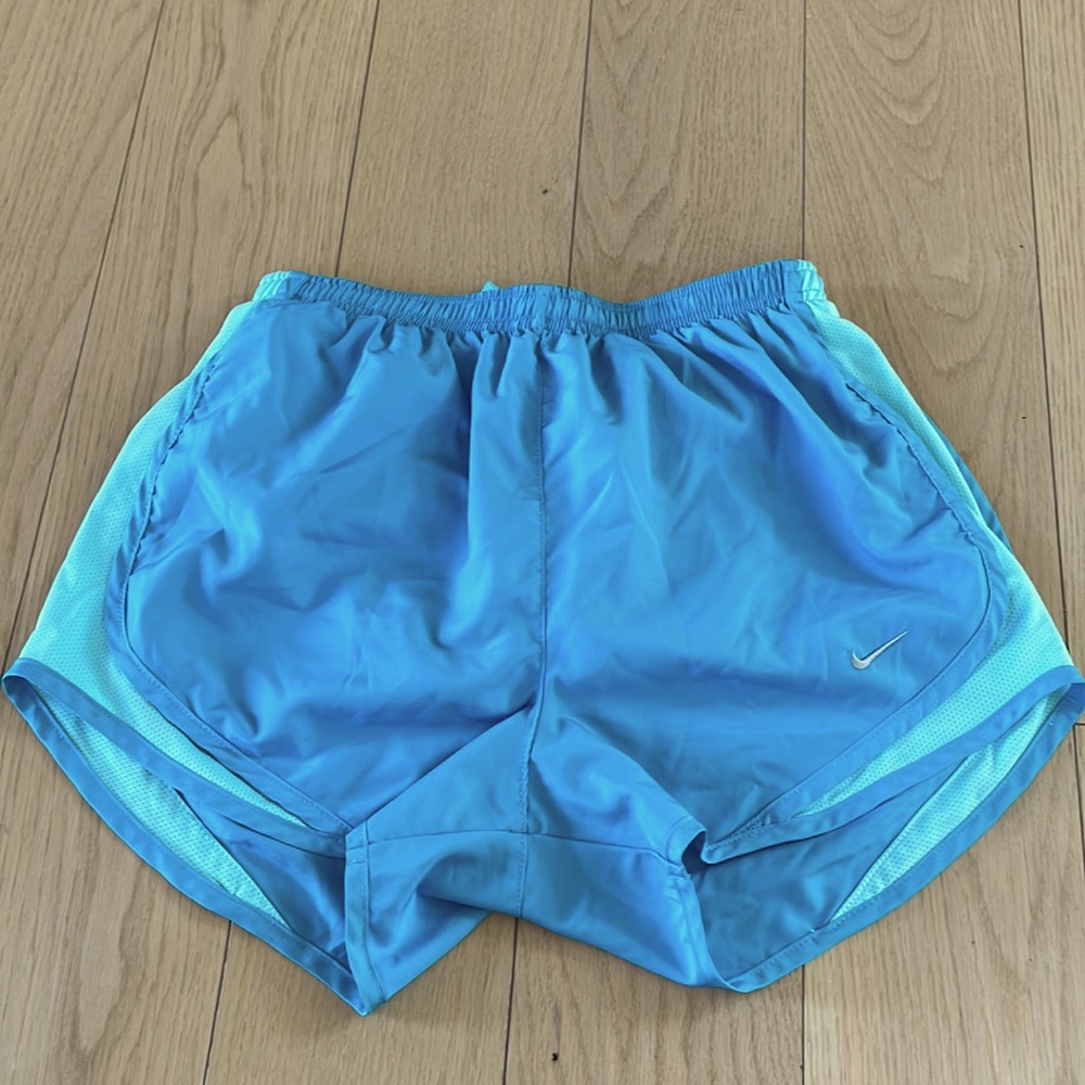 Blue Nike running shorts